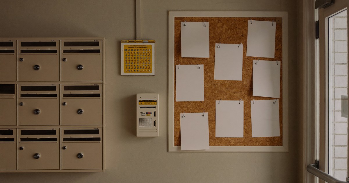 A New Jersey multifamily entrance with a tenant notice board