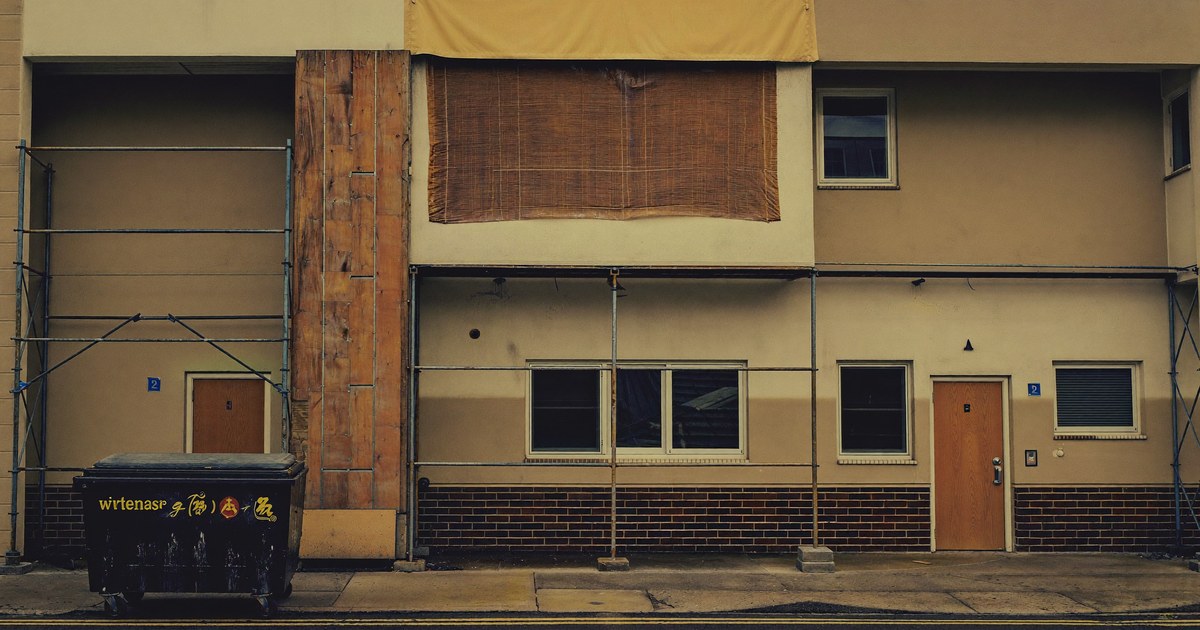 A multifamily building with a unit under repair